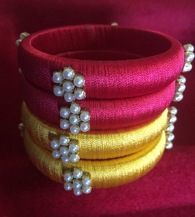 Braccialetti in filo di seta con perla