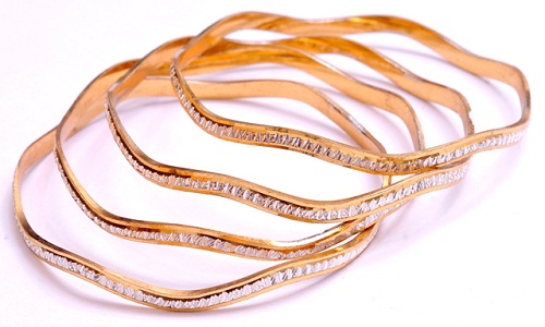 Braccialetti d'oro laminati rotondi di forma irregolare