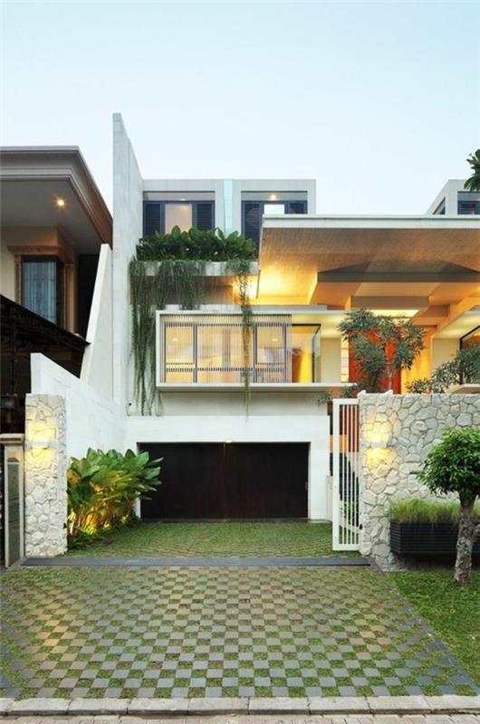 עיצוב חזית בית חד-משפחתי קדמי עיצוב גינות צמחים מוסך מדרכה מאבן