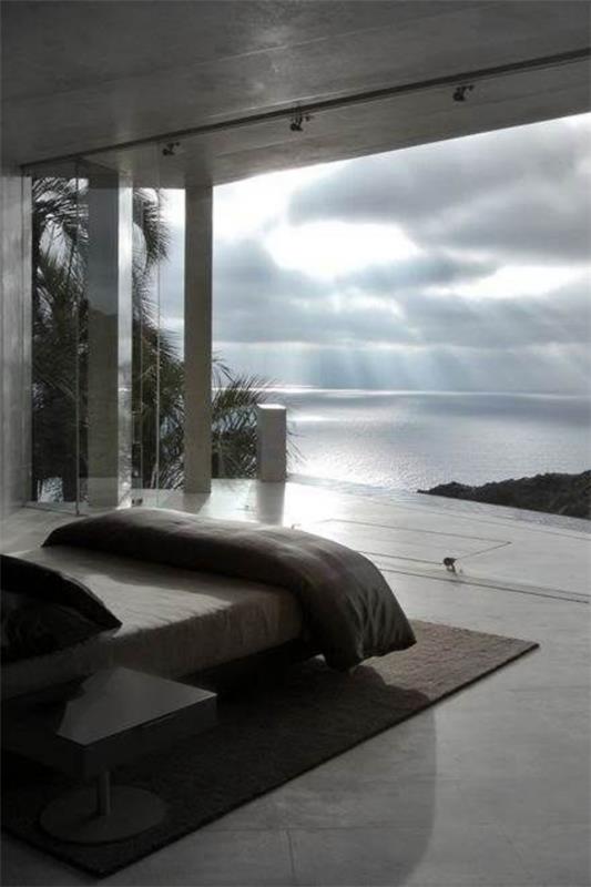 קירות זכוכית בחדר השינה עיצוב פנים מודרני נוף ים נפלא מאוד רומנטי