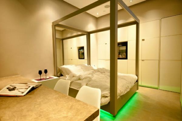 חדר שינה עתידני מעצב אור ניאון ירוק מתחת למיטה
