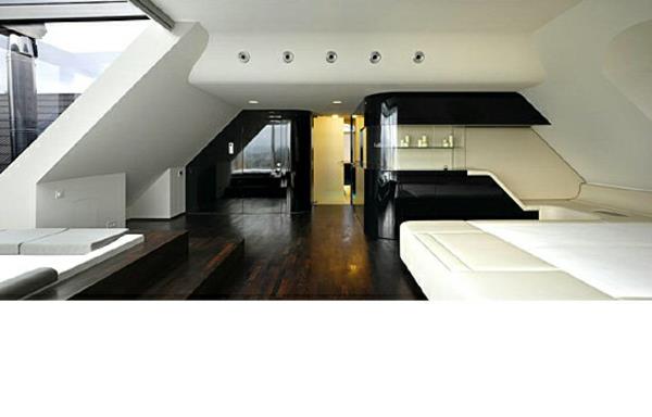 חדר שינה עתידני קירות משופעים פרקט שחור לבן וכהה