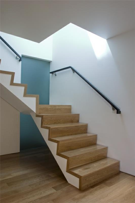 עיצוב מדרגות לולייניות מודרני מעקה ברזל מעץ בהיר