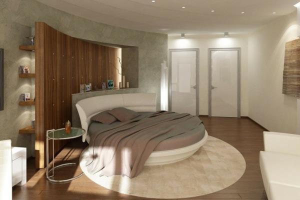 ריהוט חדר שינה מיטה זוגית עגולה שטיח עגול מדפי קיר כיסוי קיר