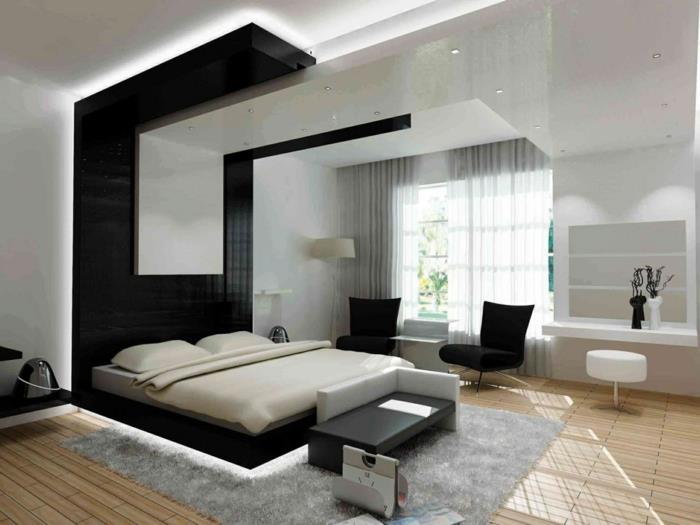 ריהוט חדר שינה עם דגשים שחורים בשטיח אפור בהיר