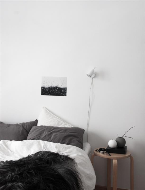 חדר שינה שולחן צד עגול שחור לבן תקרה שחורה