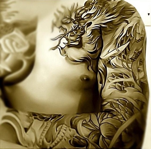Tatuaje tribal del brazo del diseño del dragón
