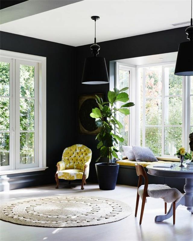 רעיונות לעיצוב קיר סלון תאורה לכורסא מהודרת בצבע קיר שחור